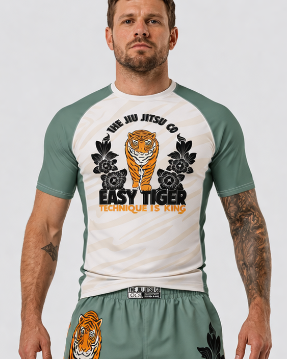 Man wearing a t-shirt and shorts with tiger graphics on a white background